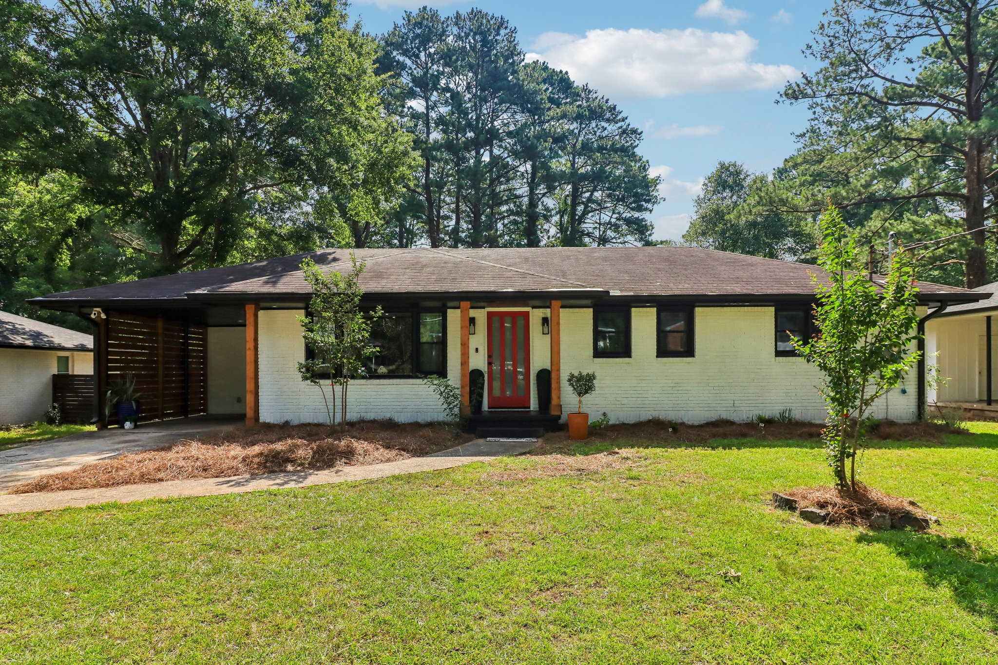 Custom-renovated ranch framed by mature trees