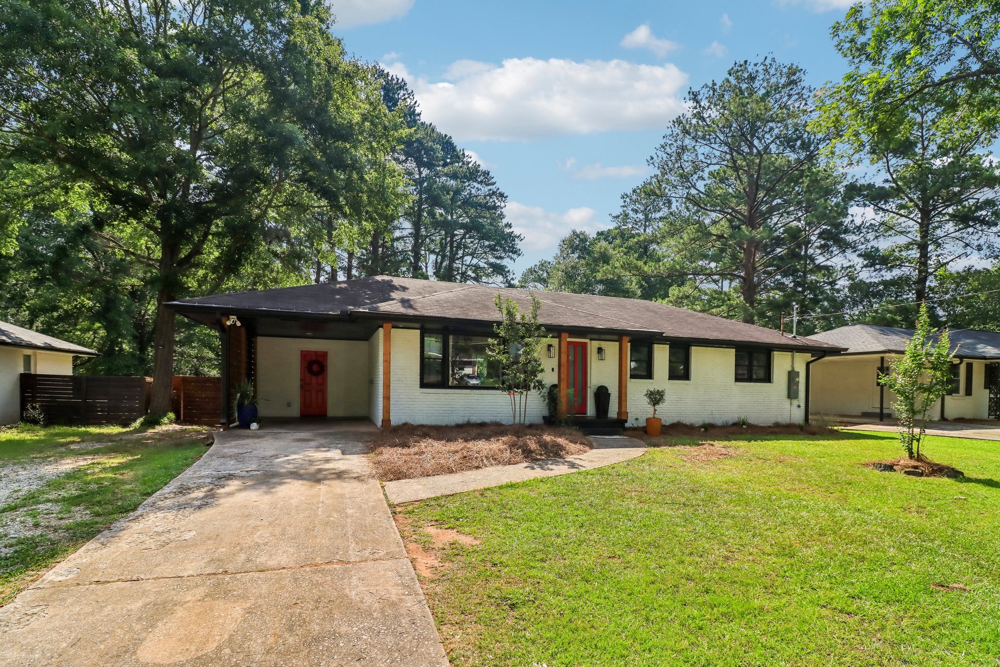 Wide exterior view showcasing the home’s modernized profile