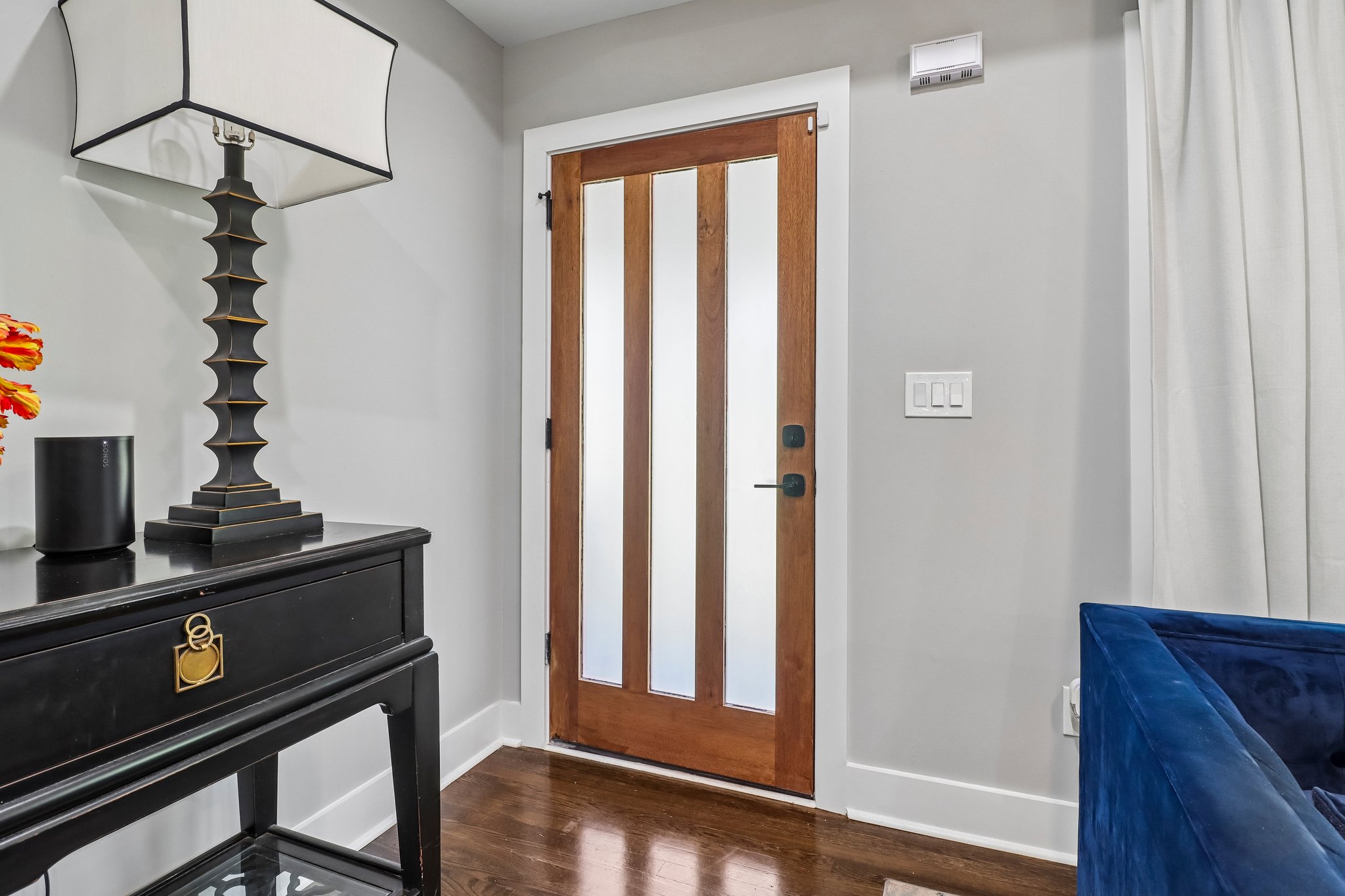 Polished entry with rich hardwoods and custom millwork