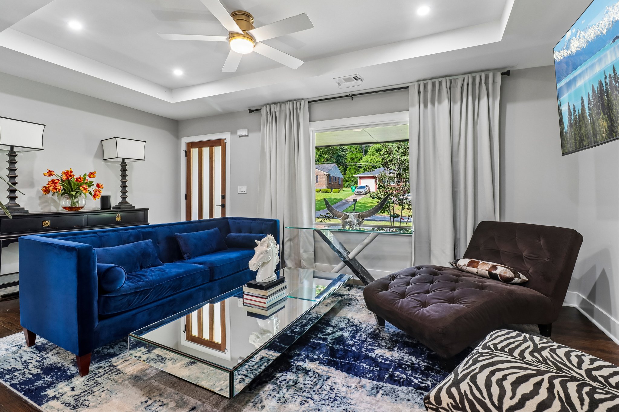 Bold blue seating anchors the sophisticated gathering space