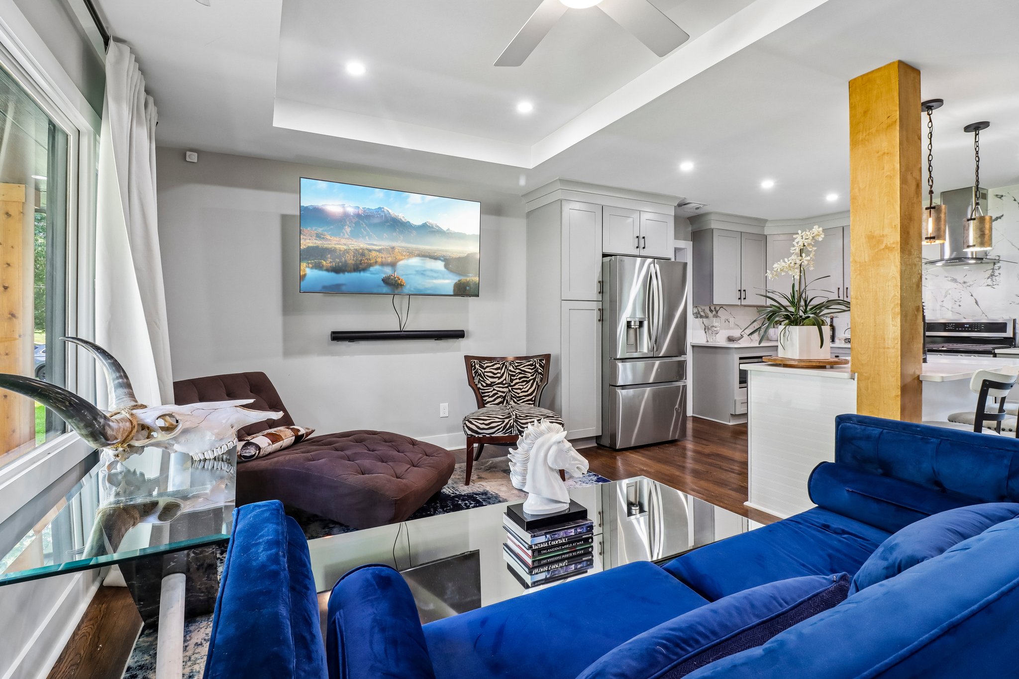 Designer living space with uninterrupted hardwood floors