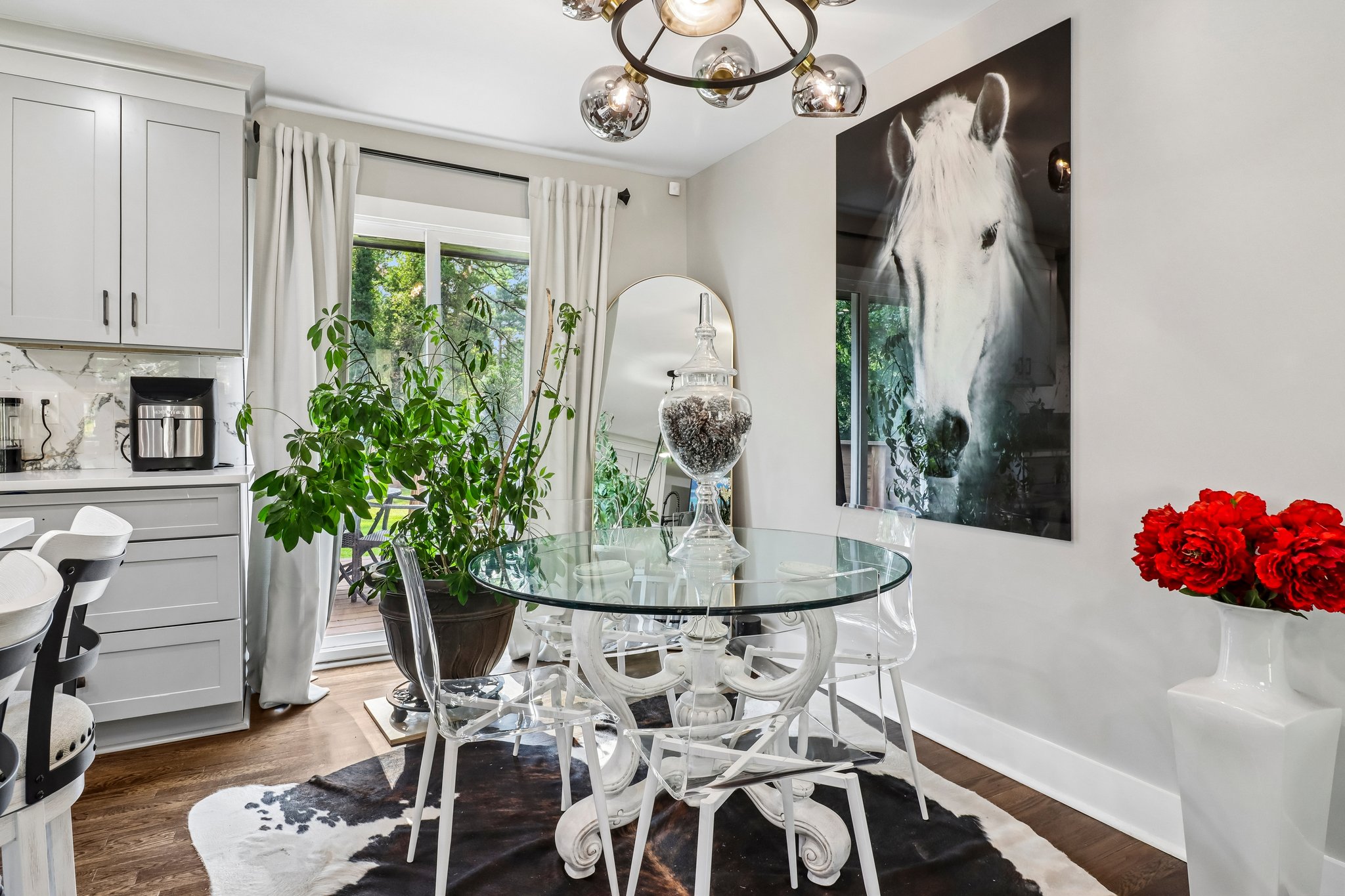 Artful dining area with garden views and dramatic décor