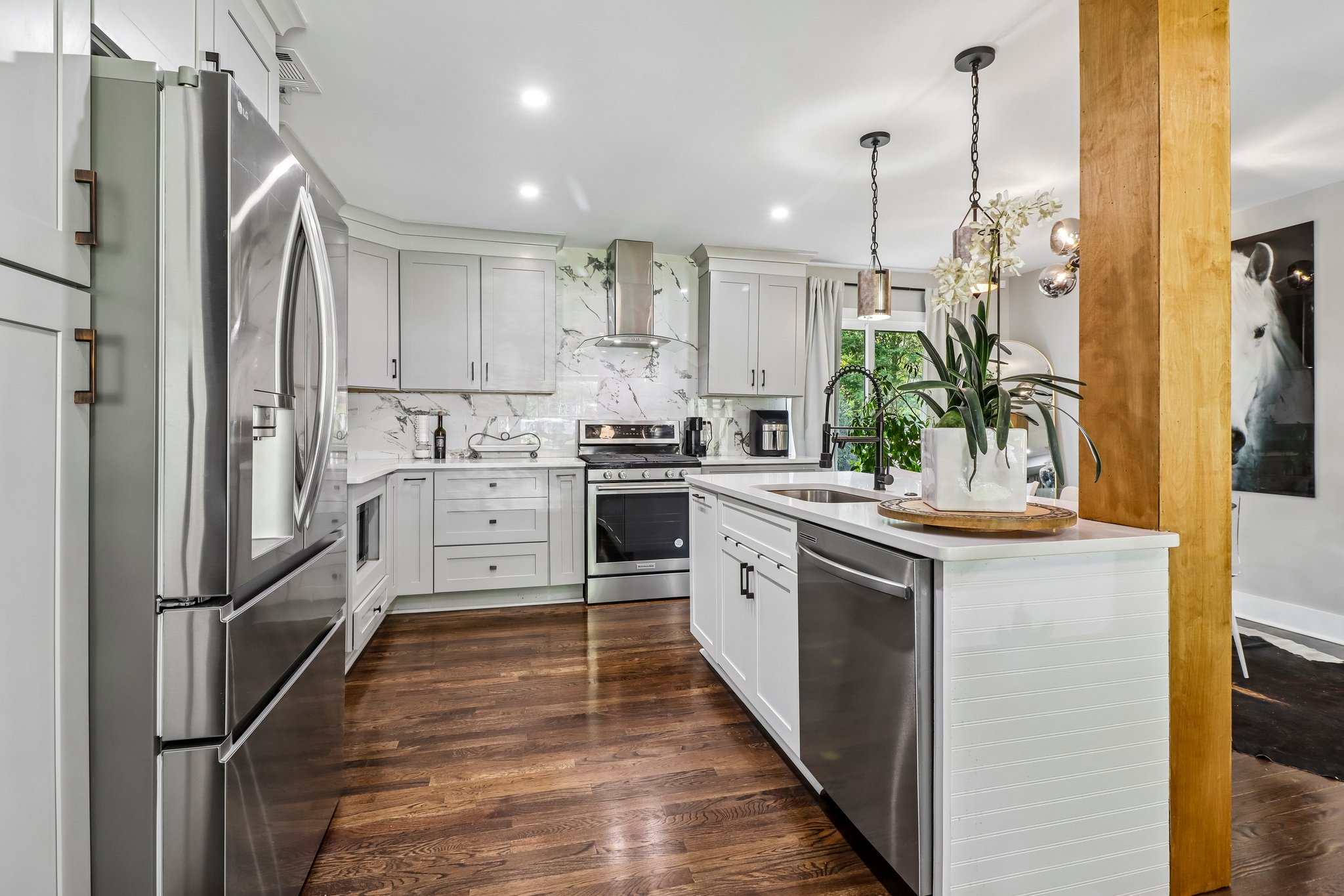 Designer backsplash and stainless appliances create a polished finish