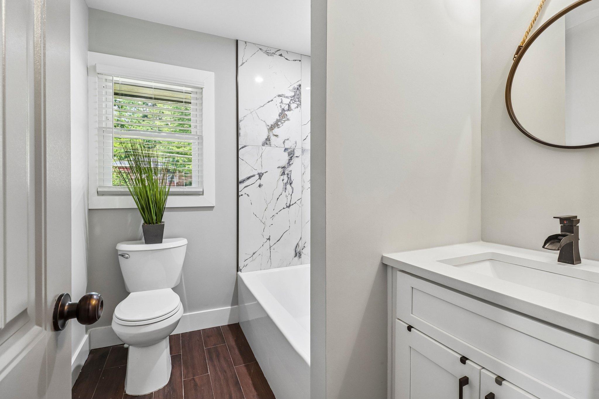 Fresh guest bath with a streamlined vanity and natural light