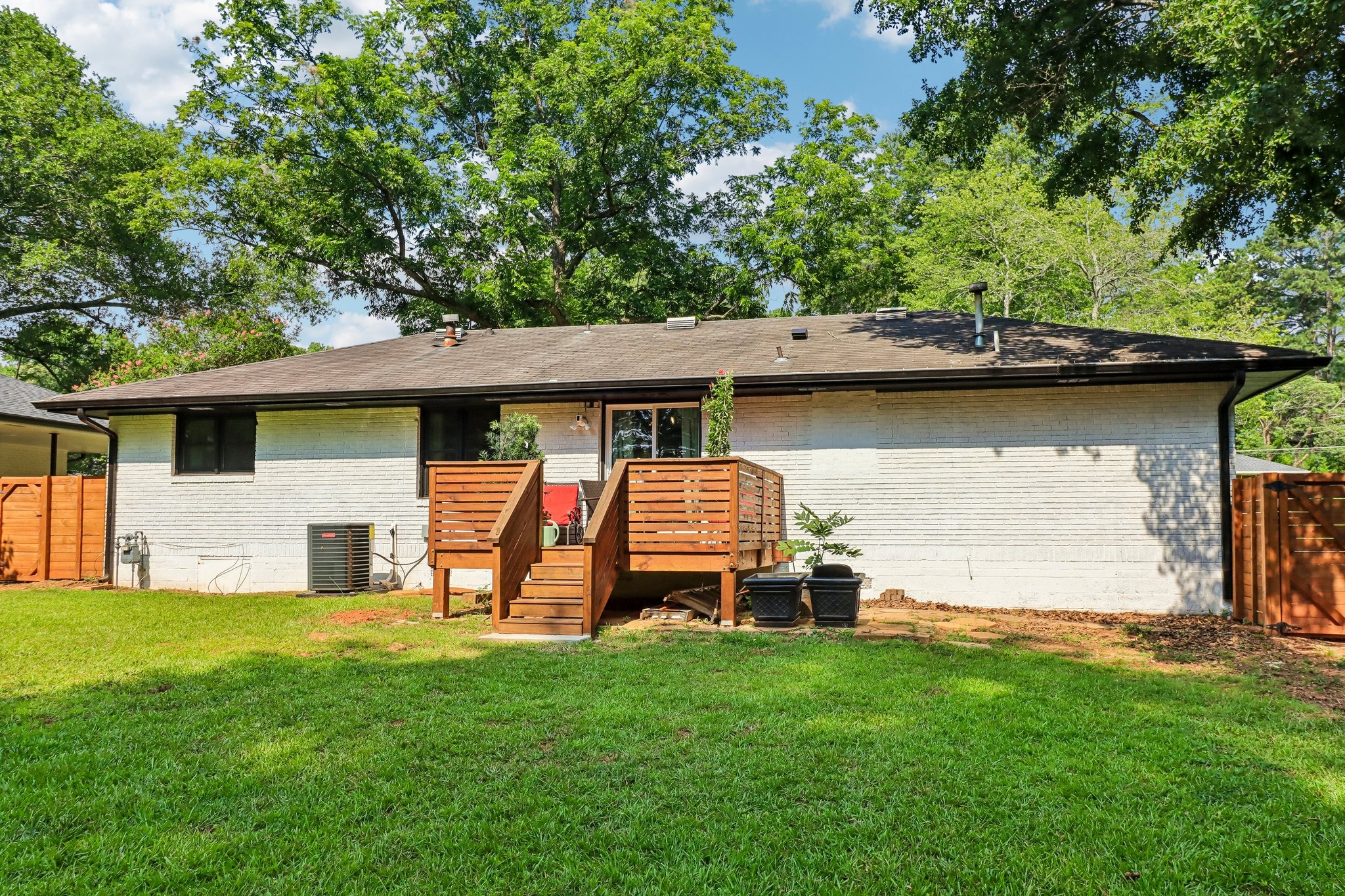 Rear elevation with a central deck and easy lawn access